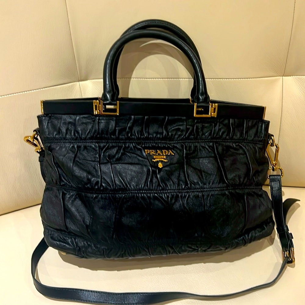 Like-new Prada quilted leather handbag with dust bag included.
